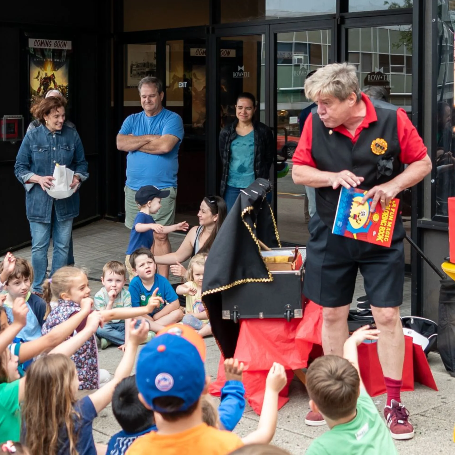 Person entertaining children — Brand Amplifier